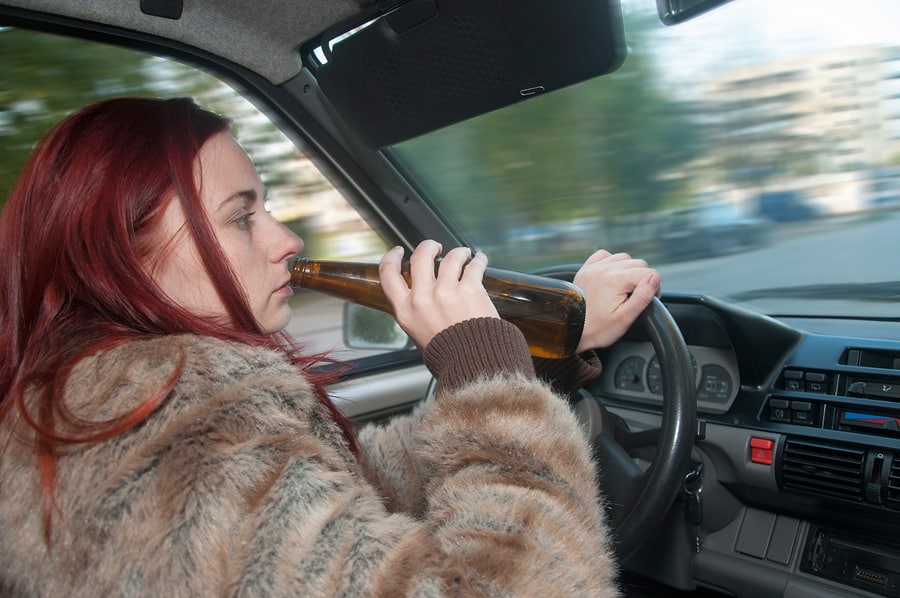 bigstock Drunk Woman Driving Car With B 52205557